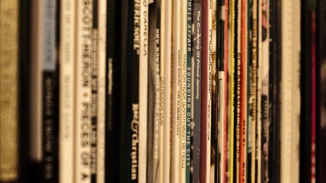 Record spines on a shelf